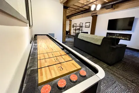Marine Iron shuffleboard table with the living room behind